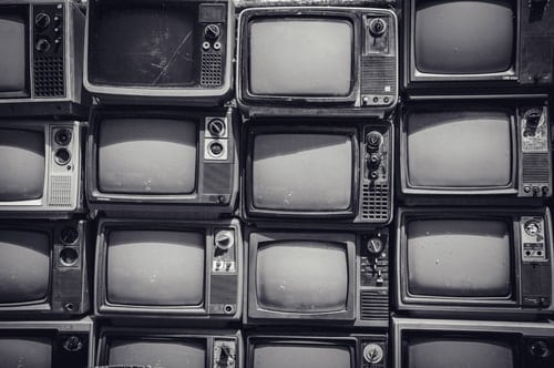 pile of TVs waiting to be recycled