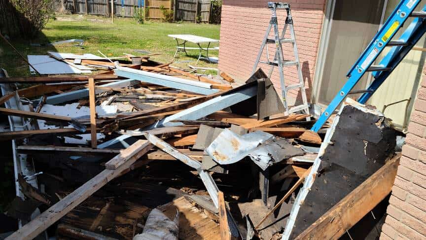 light demolition service picks up pile of remodeling debris
